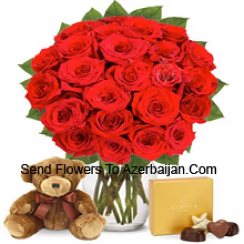 25 Red Roses With Some Ferns In A Glass Vase Accompanied With An Imported Box Of Chocolates