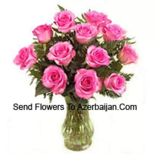 11 Pink Roses With Some Ferns In A Vase