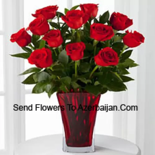11 Red Roses With Some Ferns In A Vase