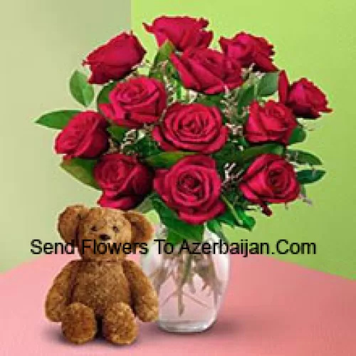 11 Red Roses With Some Ferns In A Vase And A Cute Brown 8 Inches Teddy Bear
